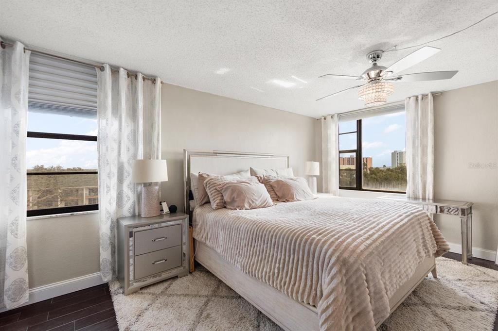 255 Dolphin Point, Unit 508 Clearwater Beach, FL 33767 - Photo 26 of 40 a bedroom with a large bed and a window