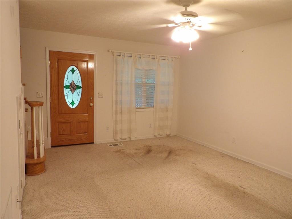 676 Graham Road Dallas, GA 30132 - Photo 14 of 19 an empty room with windows and fan