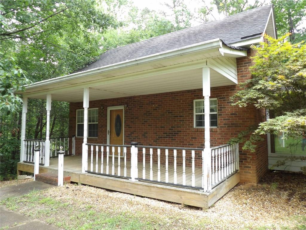 676 Graham Road Dallas, GA 30132 - Photo 3 of 19 a side view of a house with a porch