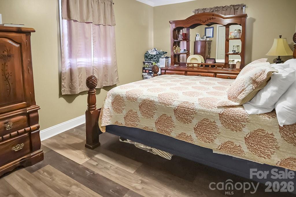 122 Rockman Road Grover, NC 28073 - Photo 15 of 45 a bedroom with a bed and a flat tv screen on the dresser