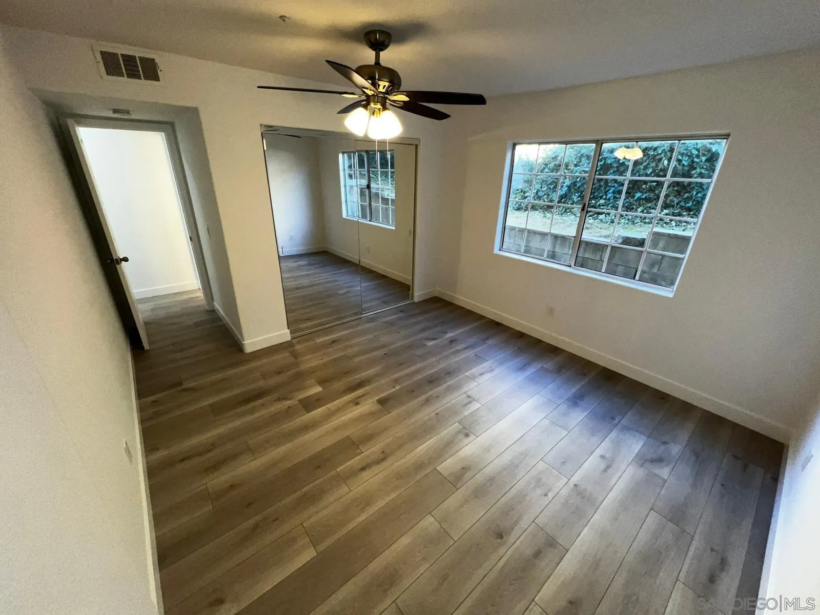 29938 Canadian Honker Road Campo, CA 91906 - Photo 4 of 20 a view of a livingroom with wooden floor and a ceiling fan
