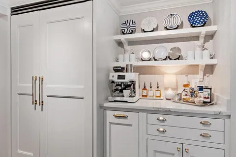 a kitchen with a refrigerator and cabinets