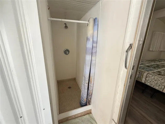 a bathroom with a tub and shower