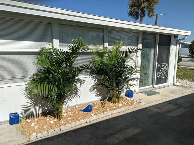 a potted plant in front of a house