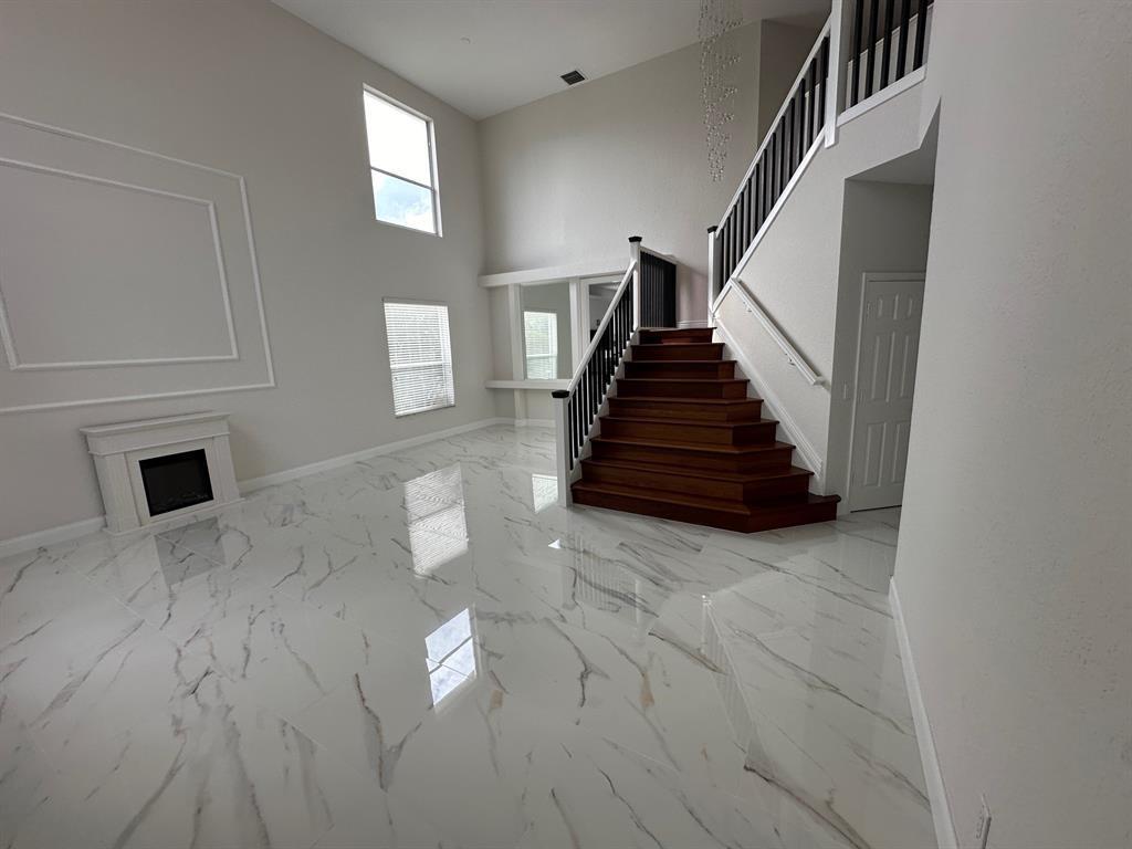 12763 Hyland Circle Boca Raton, FL 33428 - Photo 3 of 10 a view of entryway and hall with wooden floor