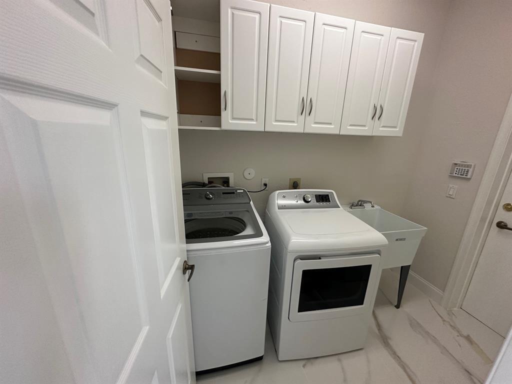 12763 Hyland Circle Boca Raton, FL 33428 - Photo 6 of 10 a utility room with dryer and washer