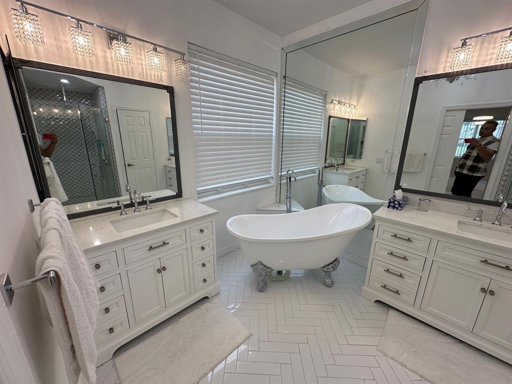 12763 Hyland Circle Boca Raton, FL 33428 - Photo 8 of 10 a bathroom with 2 sink double vanity and a mirror