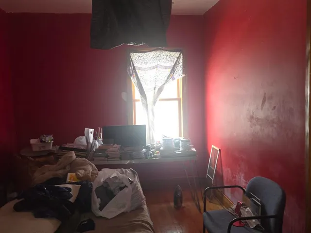 a balcony with chairs and a table