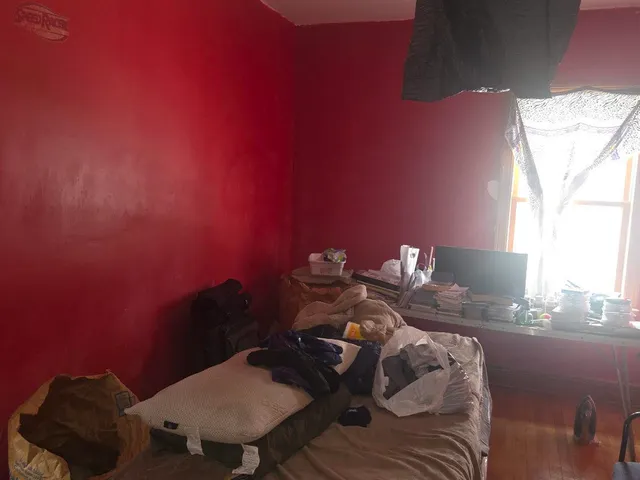 a view of a room with furniture and a window