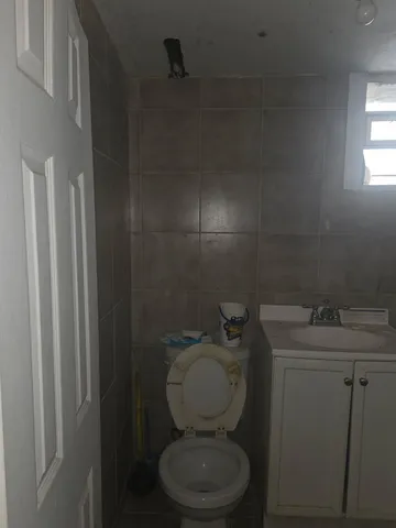 a bathroom with a shower and toilet