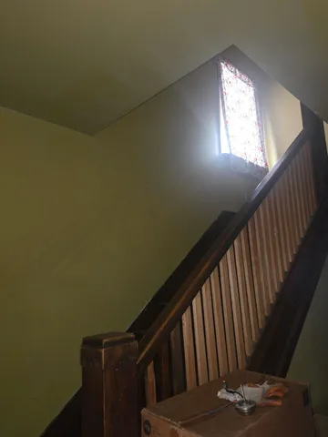 a view of balcony with wooden floor