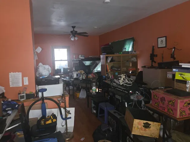 a living room with furniture and flat screen tv