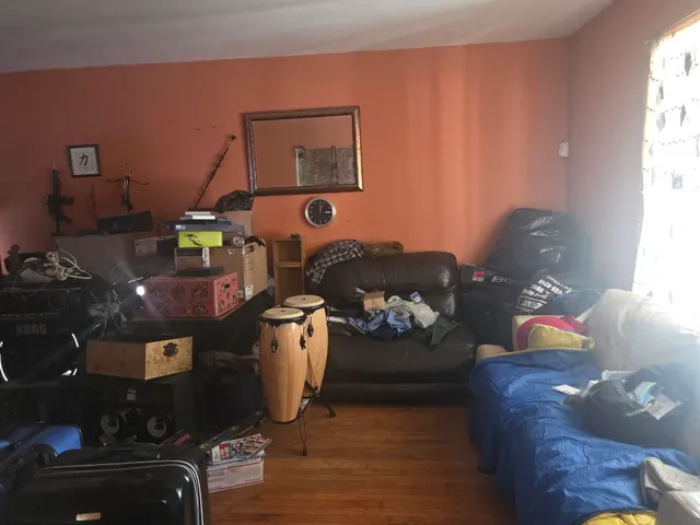 a living room with furniture and a window