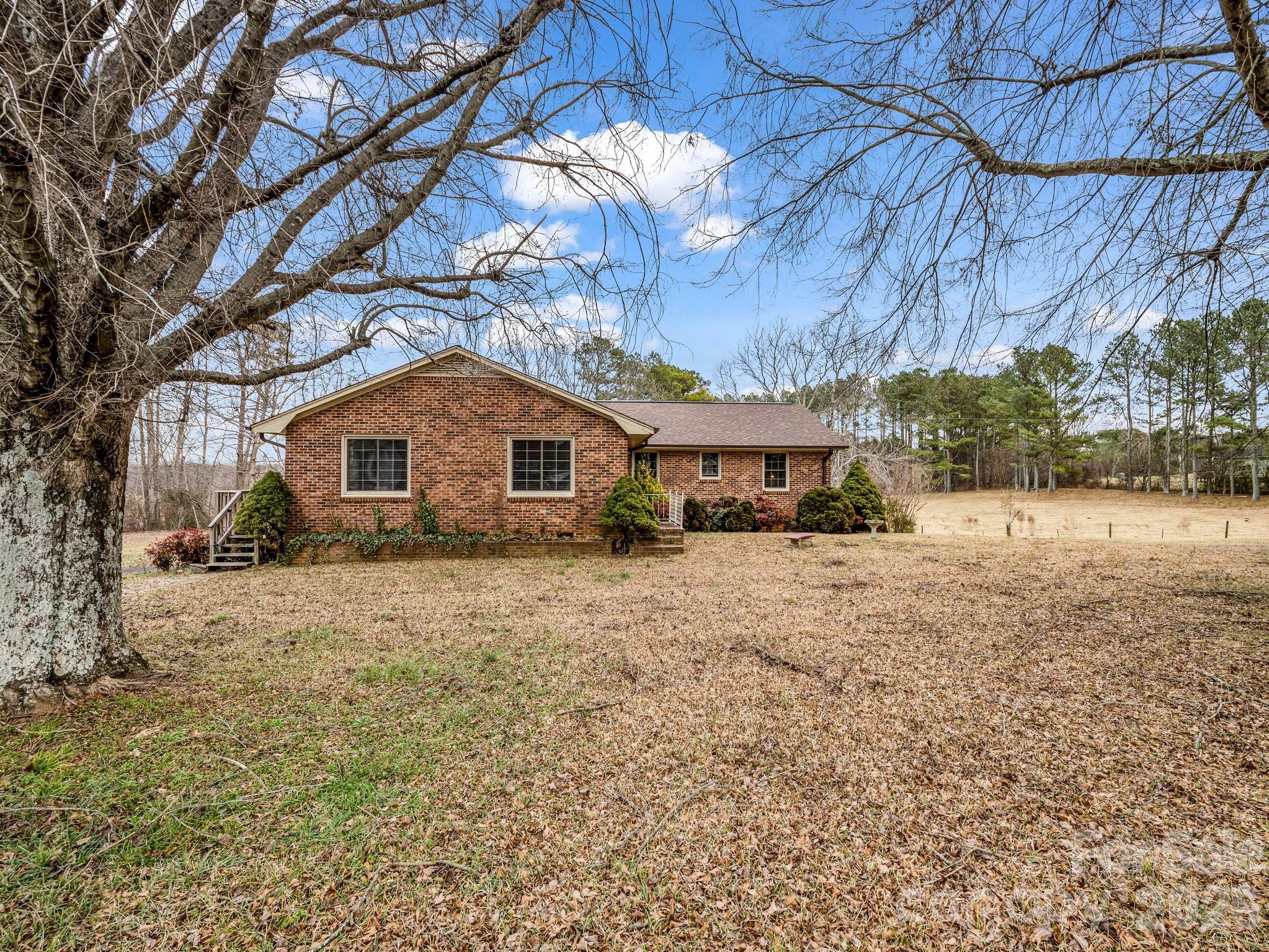 7392 Reeps Grove Church Road Vale, NC 28168 - Photo 1 of 30 a front view of a house with a yard
