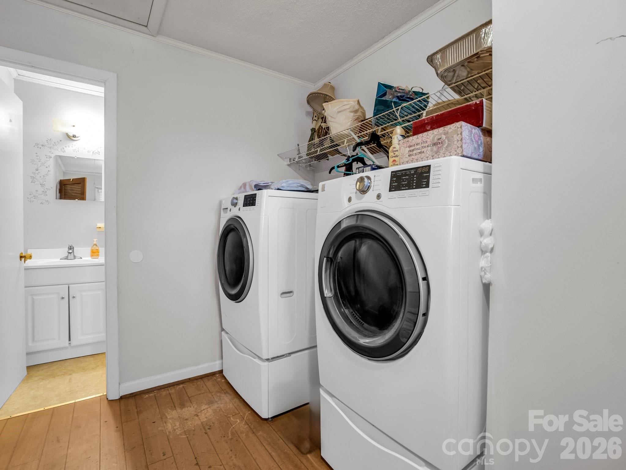7392 Reeps Grove Church Road Vale, NC 28168 - Photo 24 of 30 a utility room with sink dryer and washer