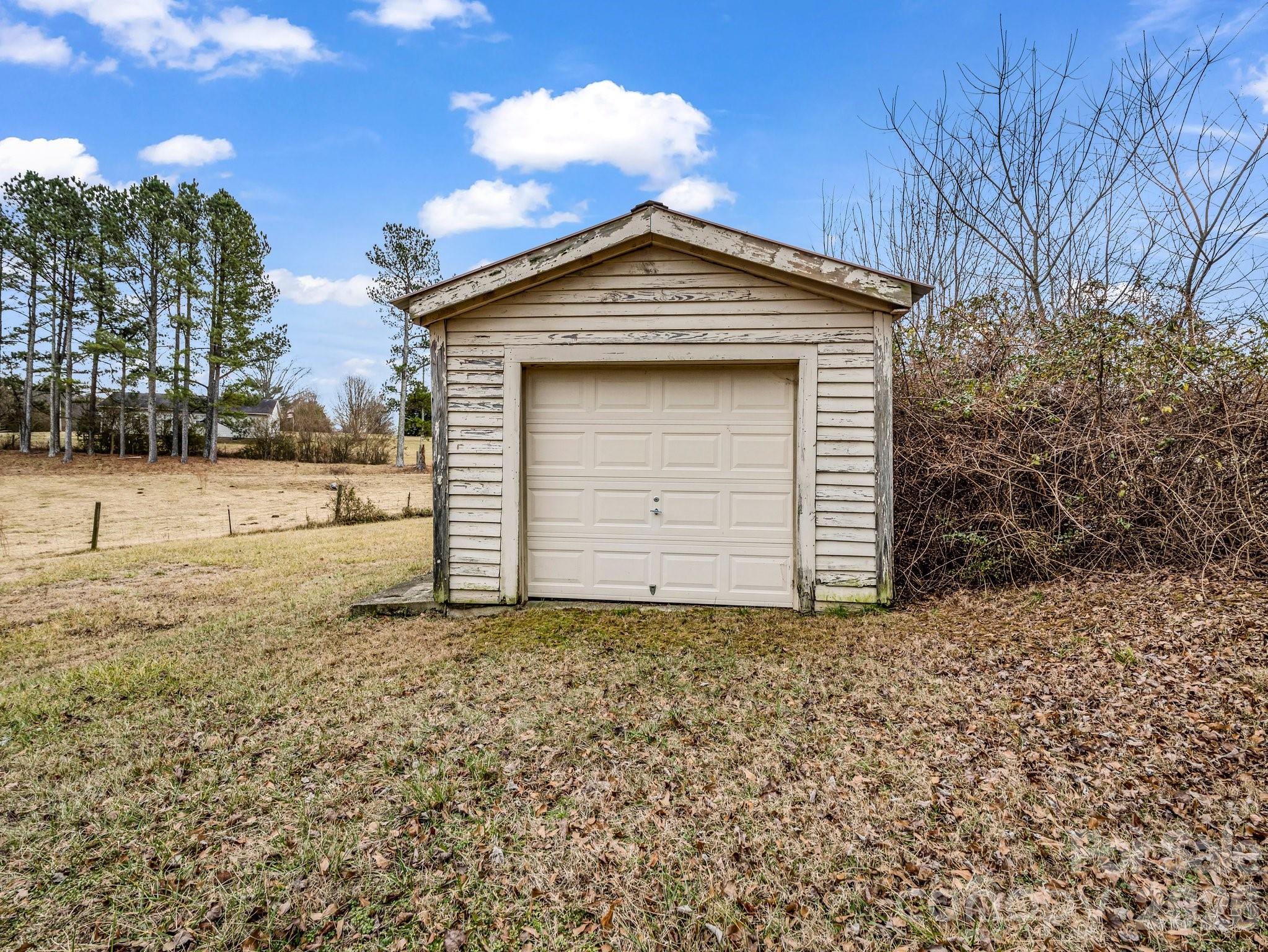 7392 Reeps Grove Church Road Vale, NC 28168 - Photo 29 of 30 a view of wooden house with large trees