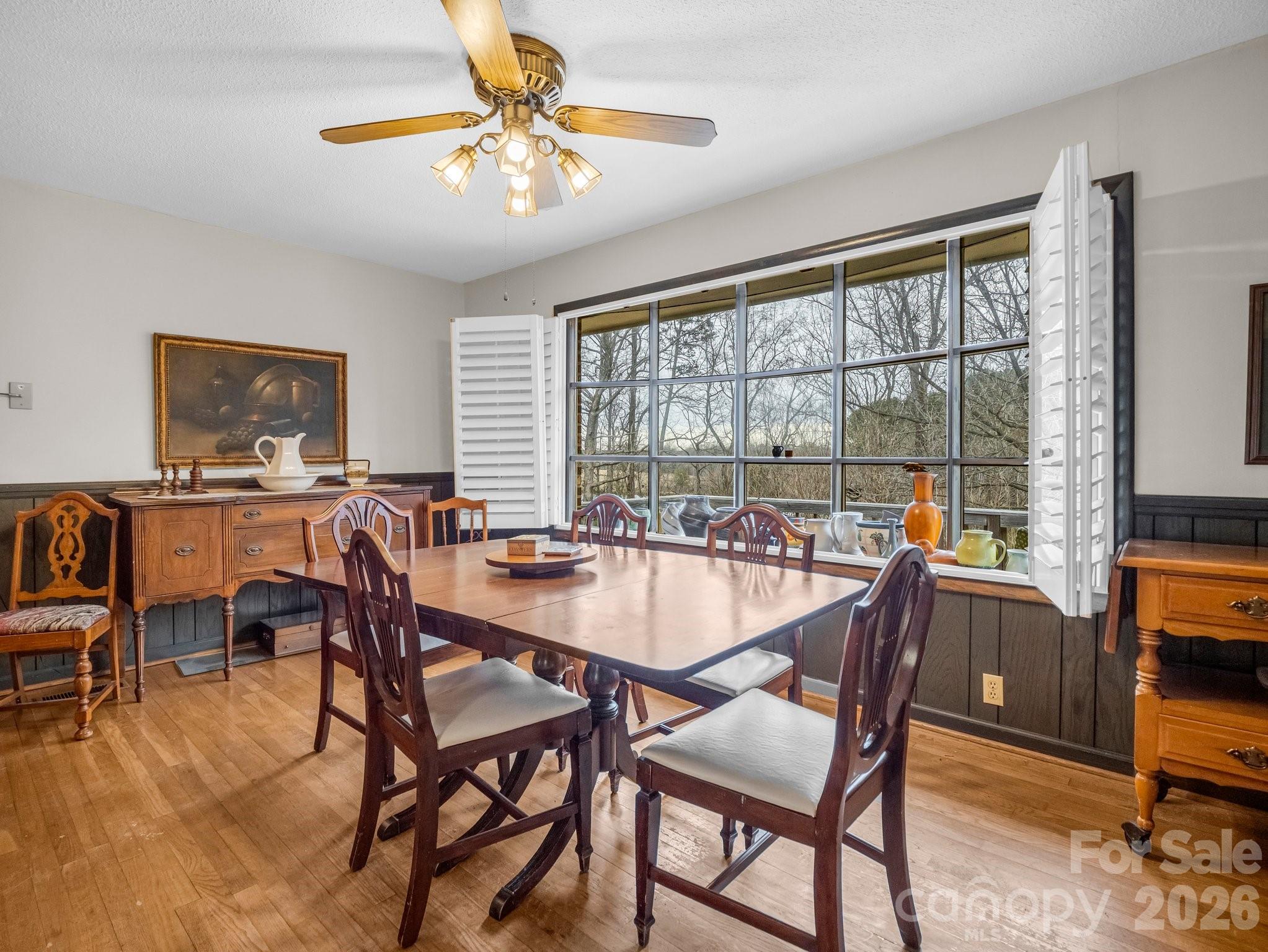 7392 Reeps Grove Church Road Vale, NC 28168 - Photo 10 of 30 a dining room with furniture a chandelier and wooden floor