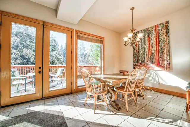 a dining room with furniture and wooden floor