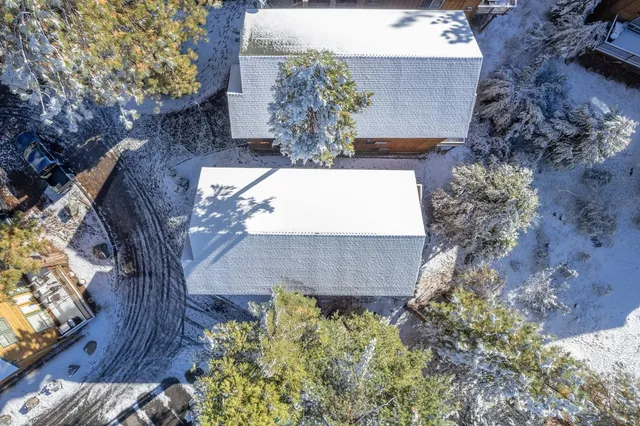 a backyard of a house with outdoor seating