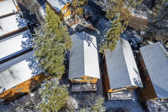 a view of a house with a yard and sitting area