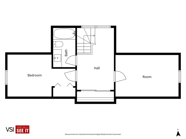 a picture of a room with a refrigerator