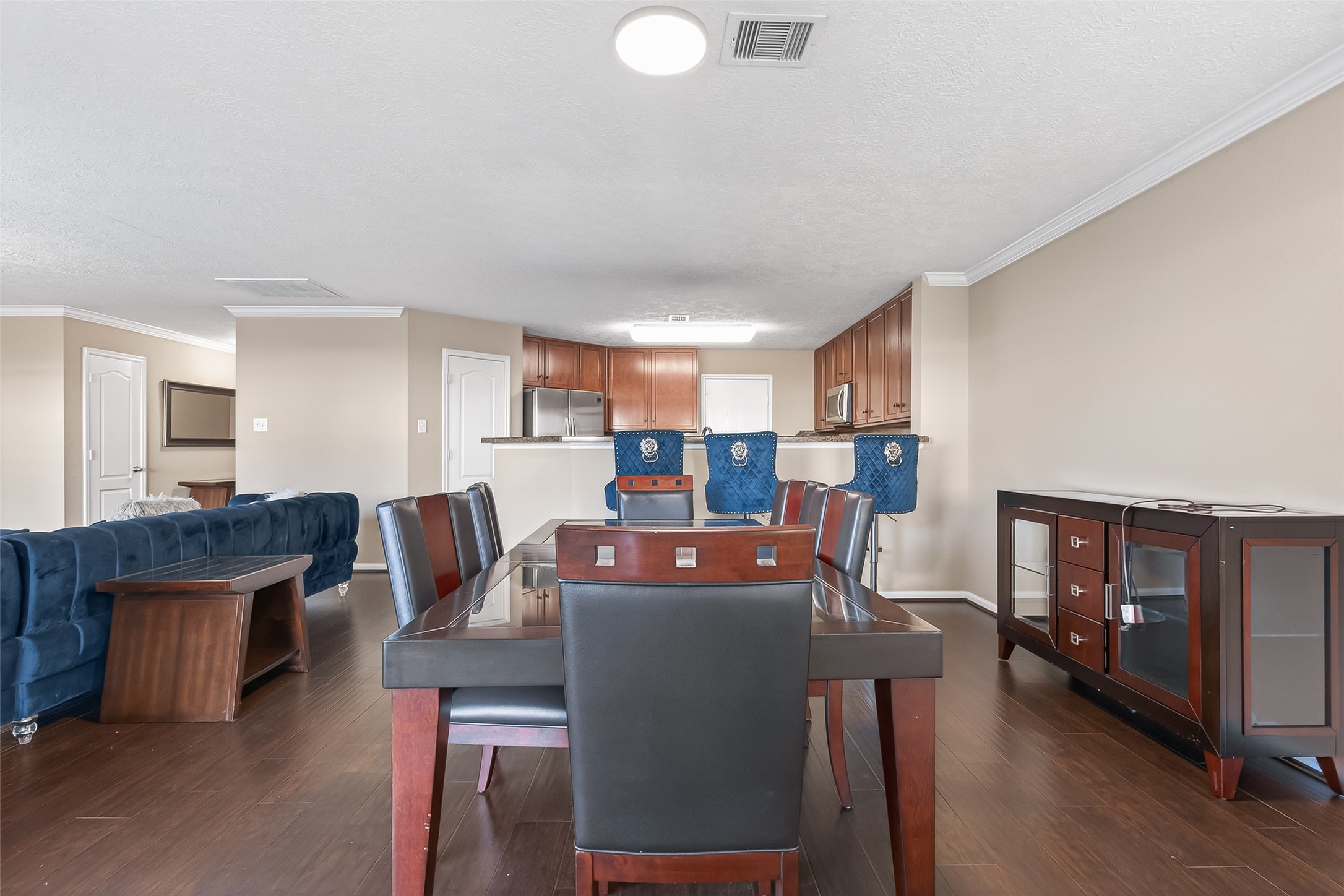 18110 Rexine Lane Cypress, TX 77433 - Photo 13 of 50 a living room with furniture a dining table and a fireplace