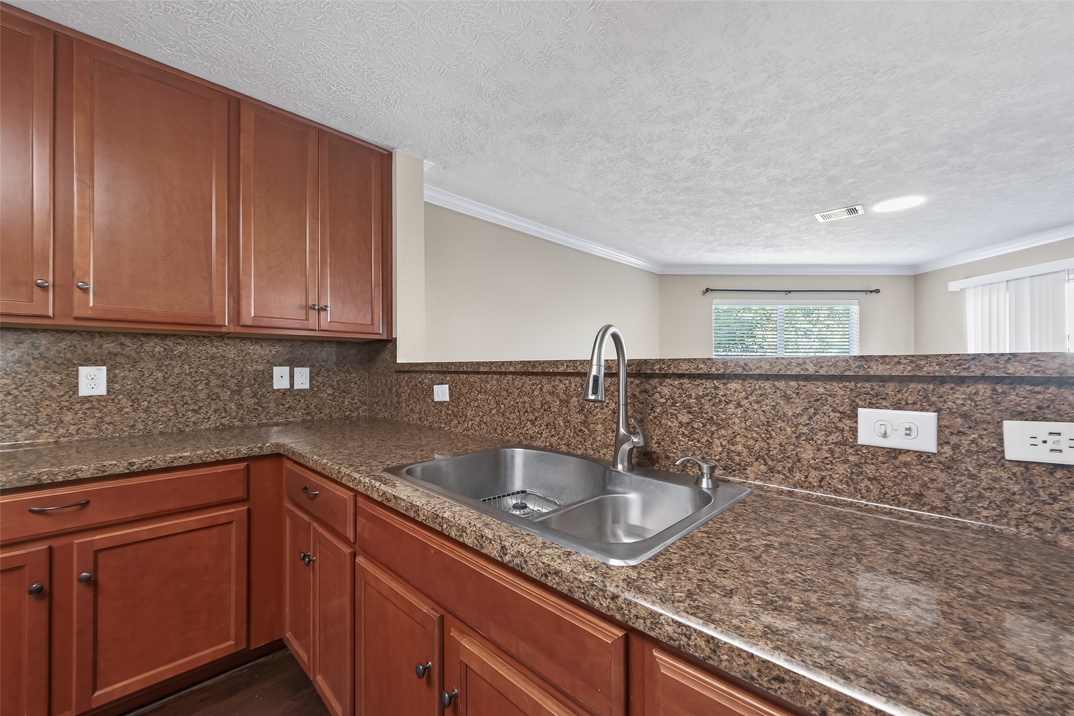 18110 Rexine Lane Cypress, TX 77433 - Photo 17 of 50 a kitchen with granite countertop a sink and cabinets