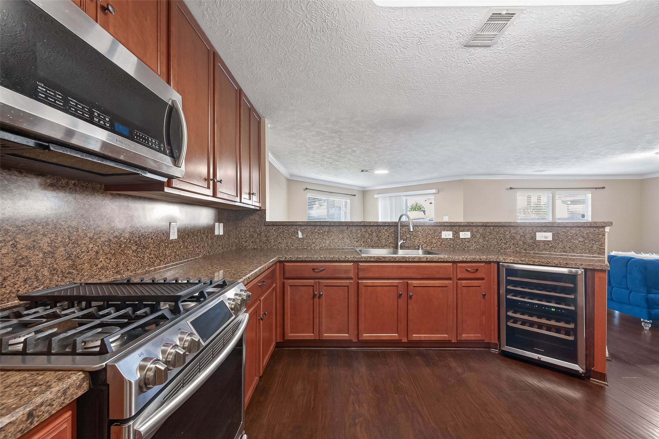 18110 Rexine Lane Cypress, TX 77433 - Photo 22 of 50 a kitchen with stainless steel appliances granite countertop a stove and a sink