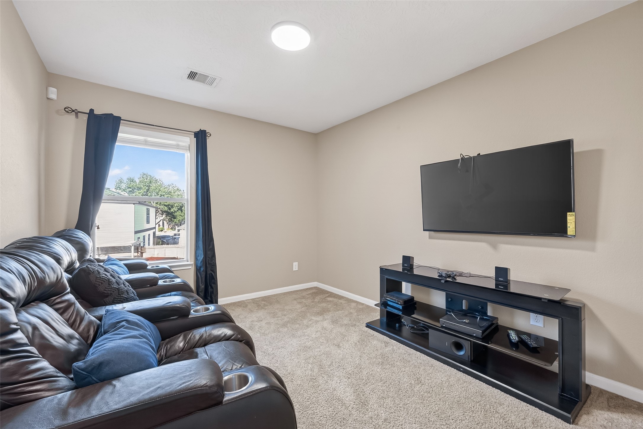 18110 Rexine Lane Cypress, TX 77433 - Photo 23 of 50 a living room with furniture and a flat screen tv