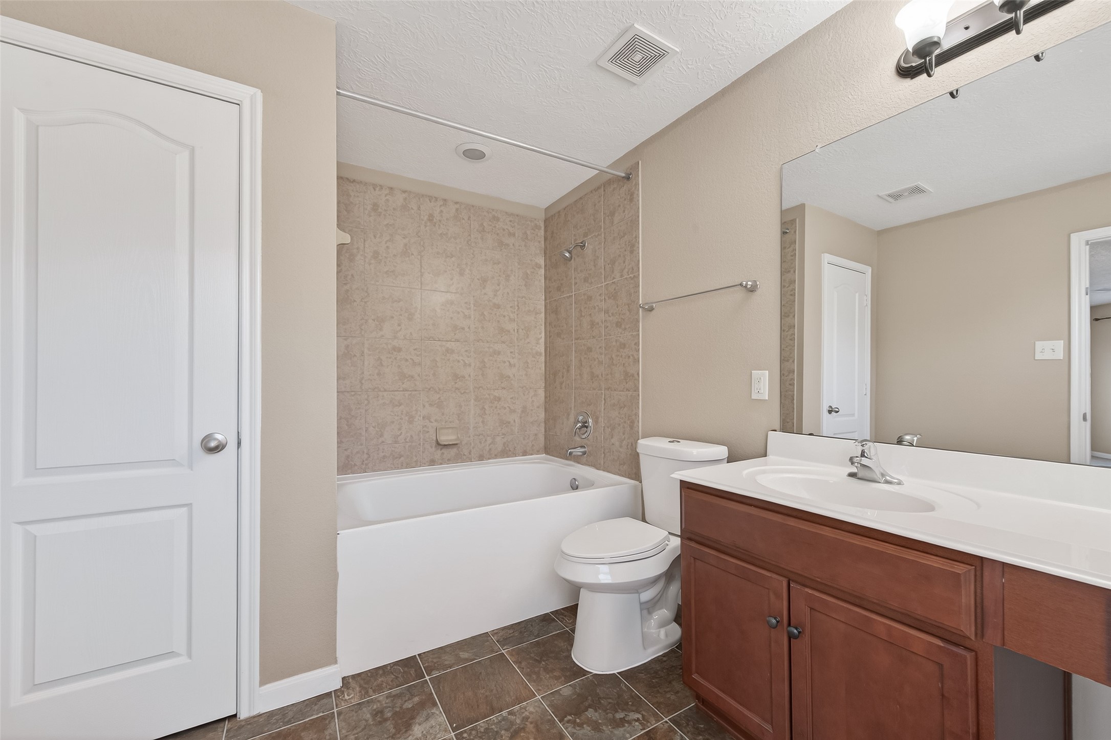18110 Rexine Lane Cypress, TX 77433 - Photo 29 of 50 a bathroom with a bathtub shower sink vanity and toilet