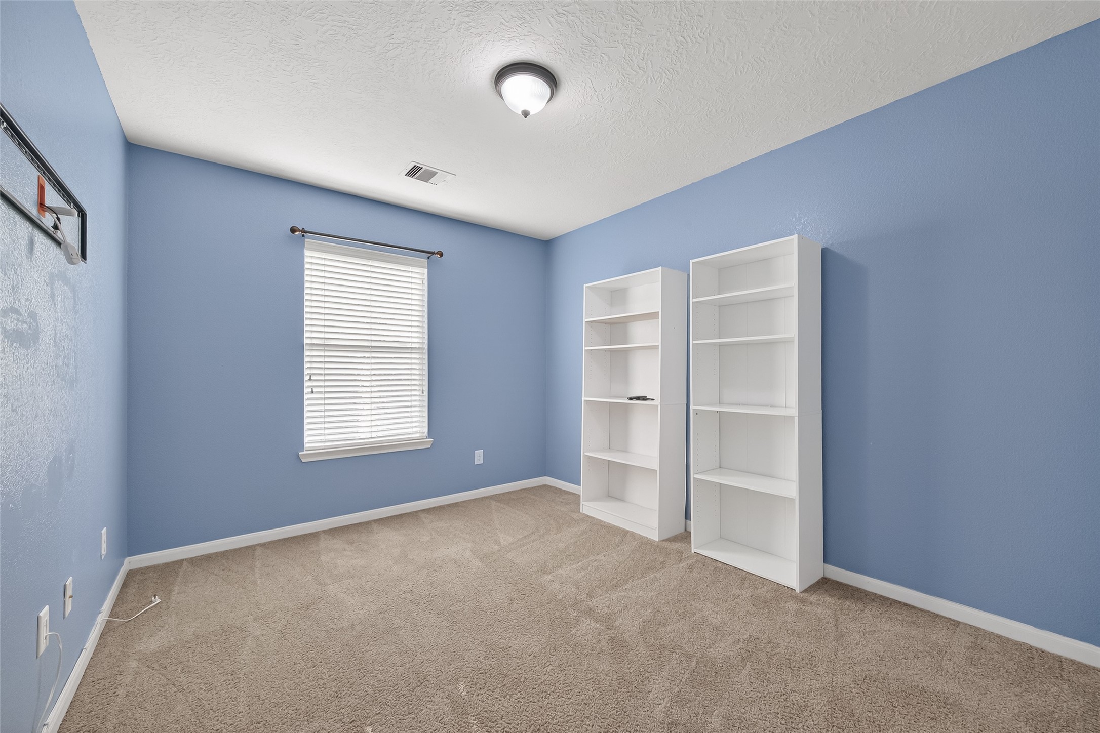 18110 Rexine Lane Cypress, TX 77433 - Photo 34 of 50 an empty room with closet and windows