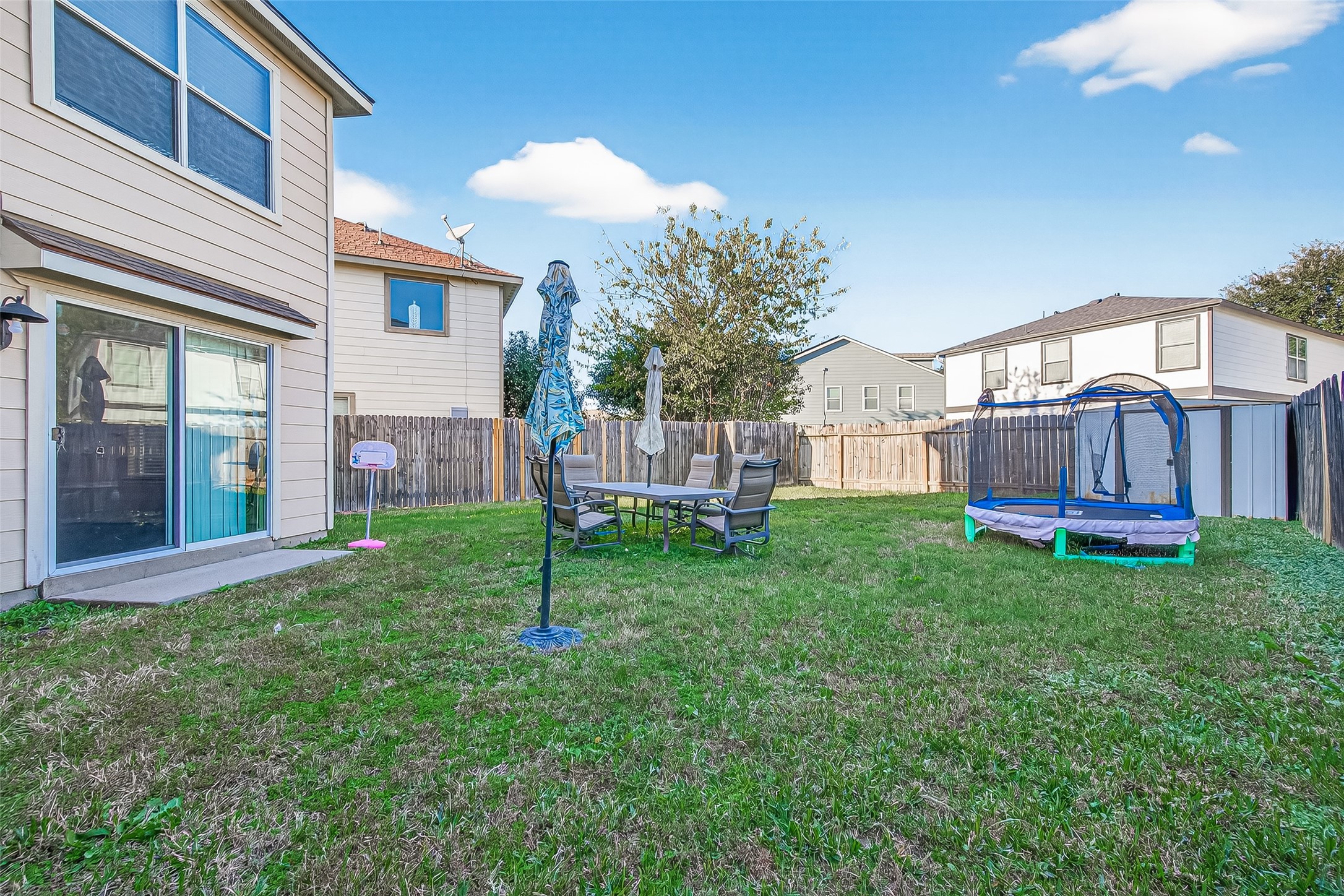 18110 Rexine Lane Cypress, TX 77433 - Photo 39 of 50 a view of a house with a backyard and a patio
