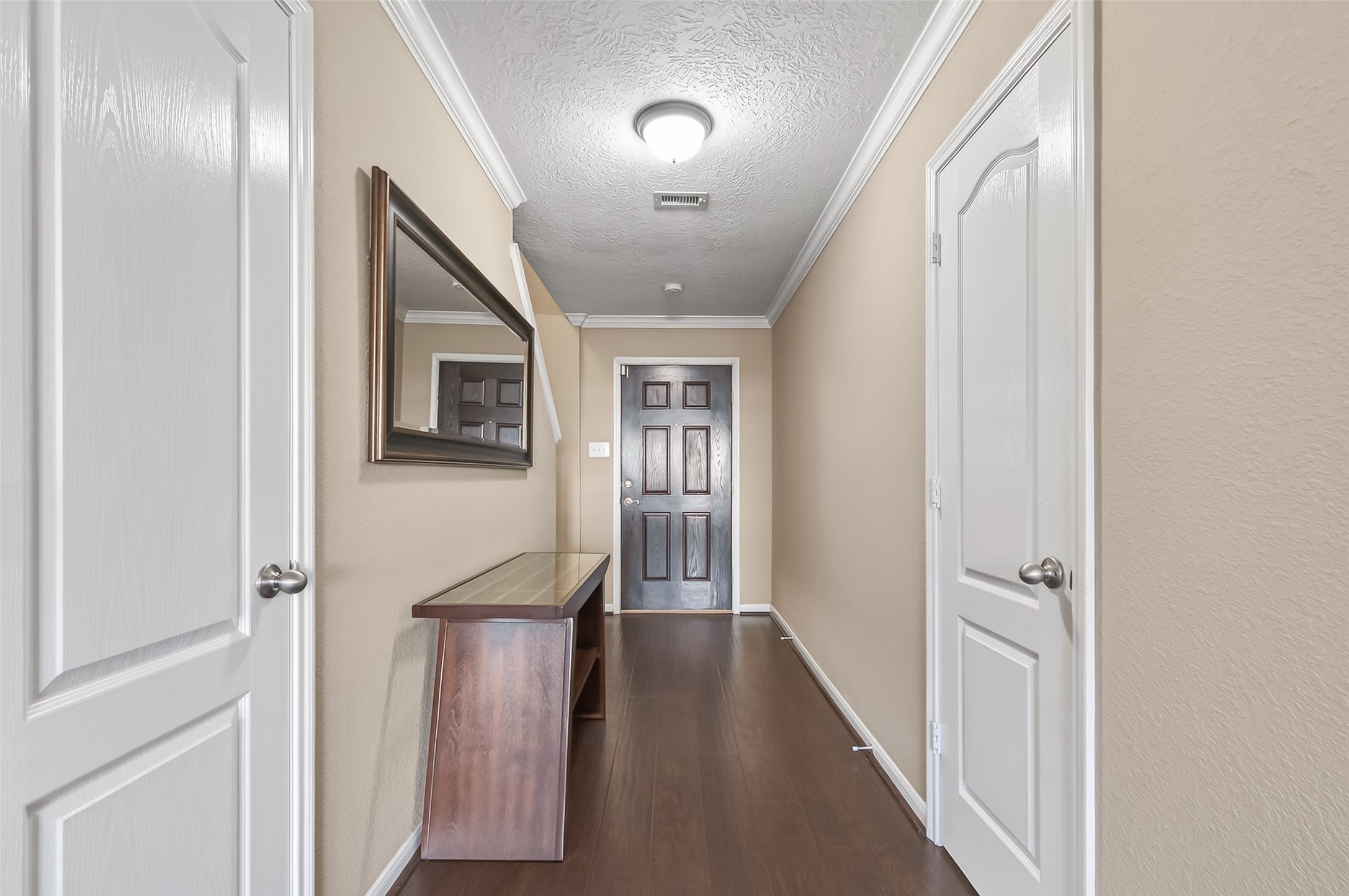 18110 Rexine Lane Cypress, TX 77433 - Photo 6 of 50 a view of a hallway with wooden floor and staircase