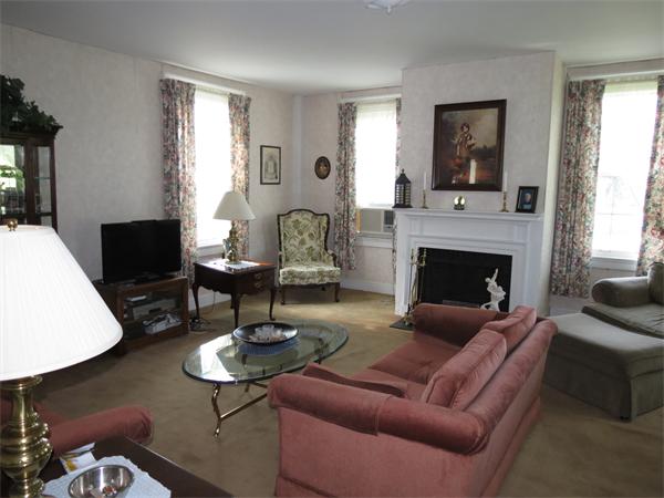 301 Boston Road Sutton, MA 01590 - Photo 20 of 30 a living room with furniture and a fireplace