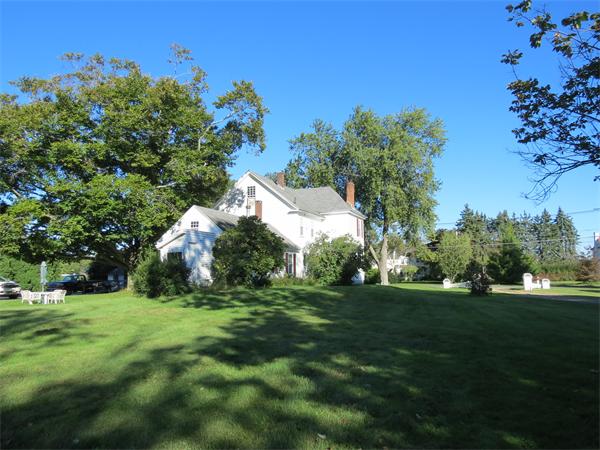 301 Boston Road Sutton, MA 01590 - Photo 28 of 30 a backyard of a house with lots of green space