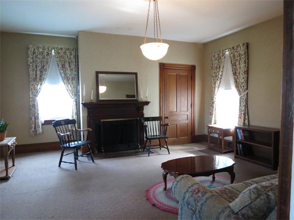 301 Boston Road Sutton, MA 01590 - Photo 7 of 30 a living room with furniture a fireplace and a large mirror