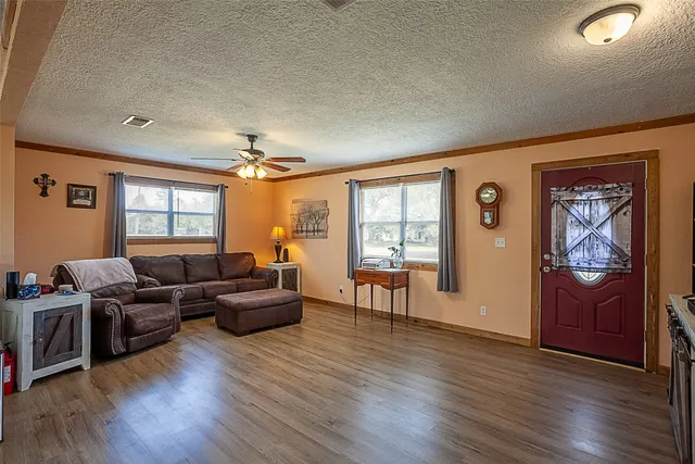 a living room with furniture and a window