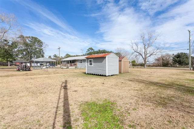 a backyard of apartments with large trees