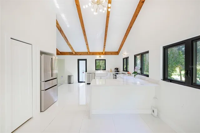 a bedroom with a bed and a dresser in it