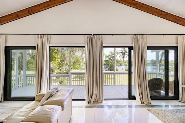 a view of a house with backyard porch and sitting area