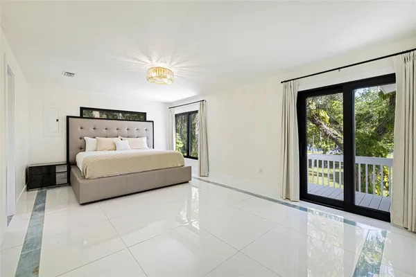 a kitchen with white cabinets stainless steel appliances and sink