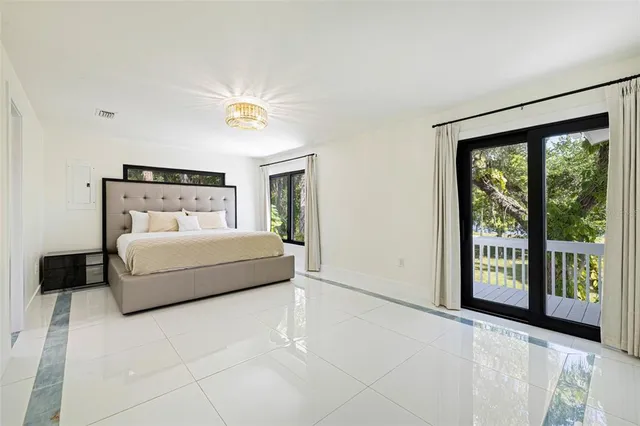 a kitchen with white cabinets stainless steel appliances and sink