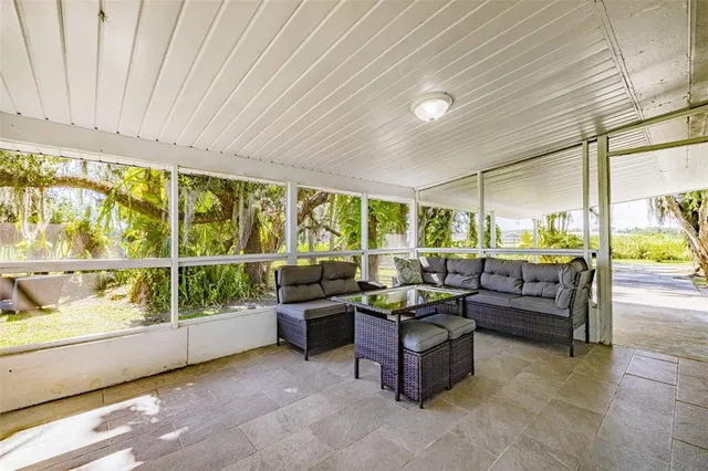 a view of swimming pool with a garden and seating area