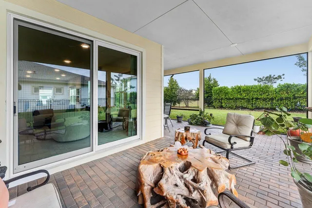 a view of an room with wooden floor and a ceiling fan