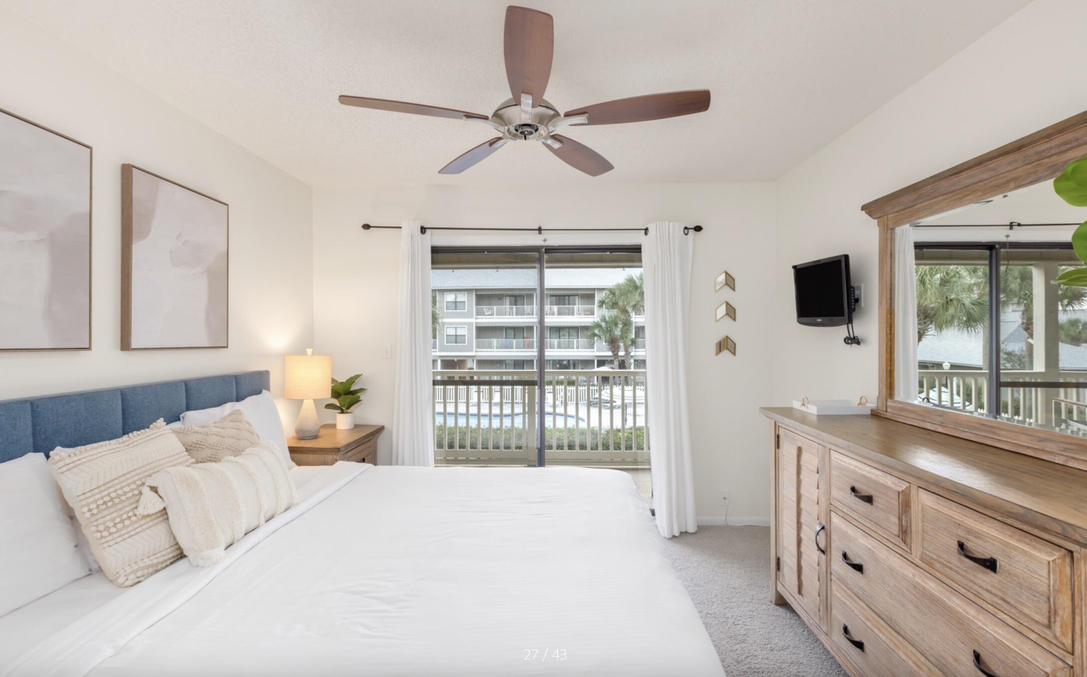 3799 East County Highway 30A, Unit E12 Santa Rosa Beach, FL 32459 - Photo 15 of 34 a bedroom with a large bed and a window