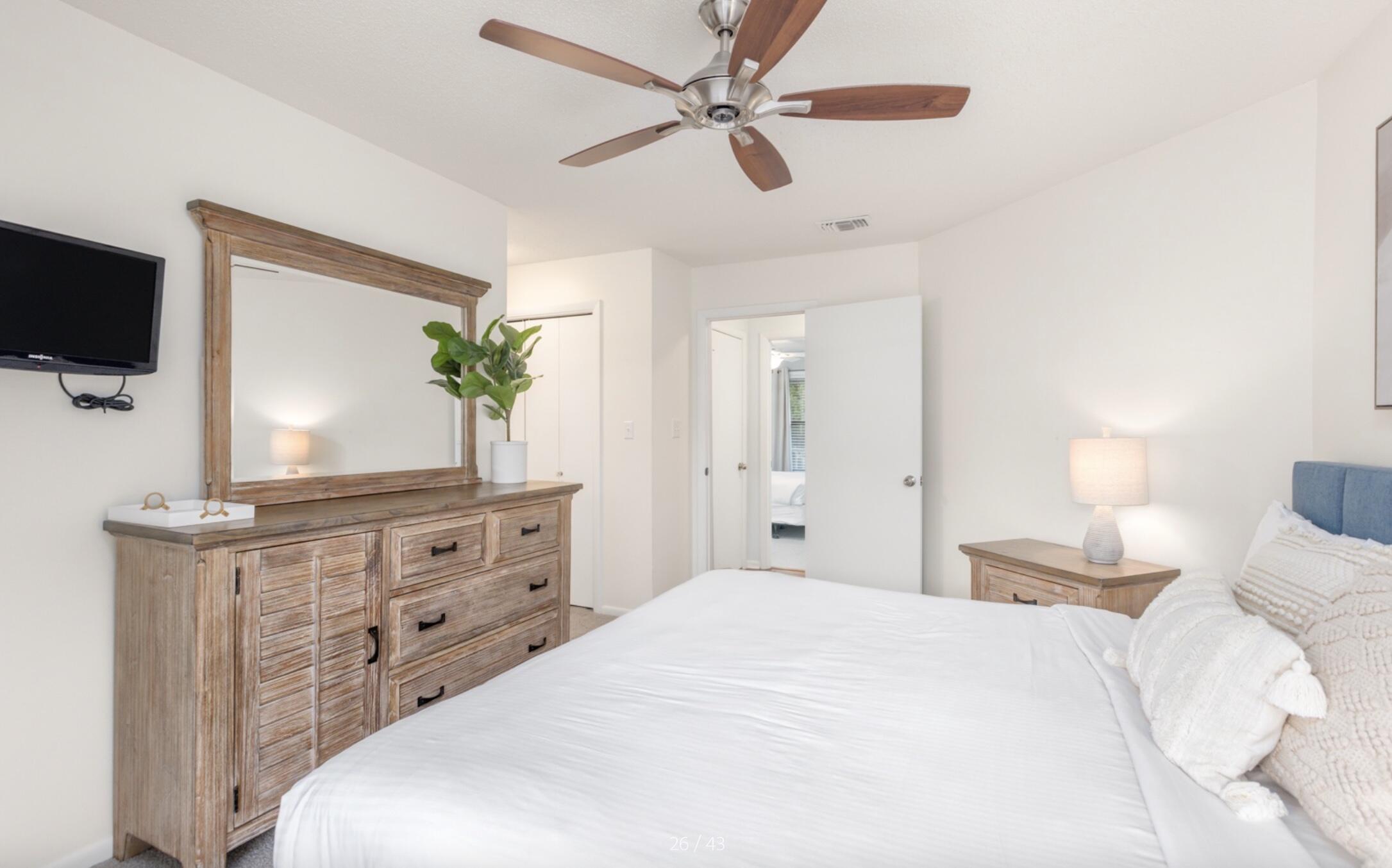 3799 East County Highway 30A, Unit E12 Santa Rosa Beach, FL 32459 - Photo 16 of 34 a bedroom with a bed a dresser and a flat screen tv