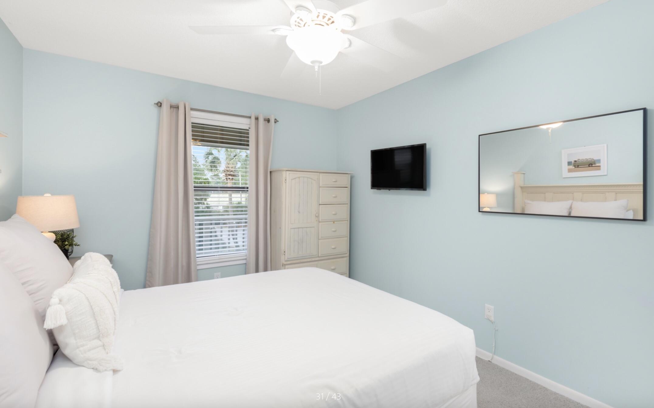 3799 East County Highway 30A, Unit E12 Santa Rosa Beach, FL 32459 - Photo 19 of 34 a bedroom with a bed and a flat screen tv