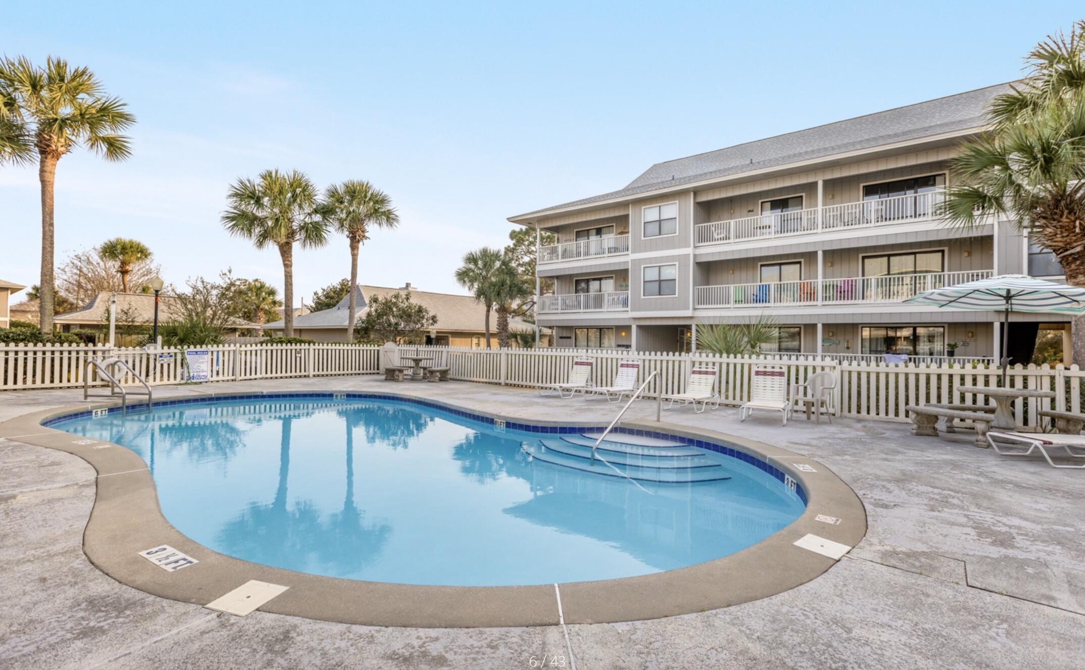 3799 East County Highway 30A, Unit E12 Santa Rosa Beach, FL 32459 - Photo 26 of 34 a view of a swimming pool with outdoor seating