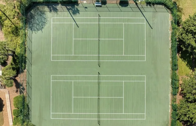 a view of a wrought iron fences in front of house