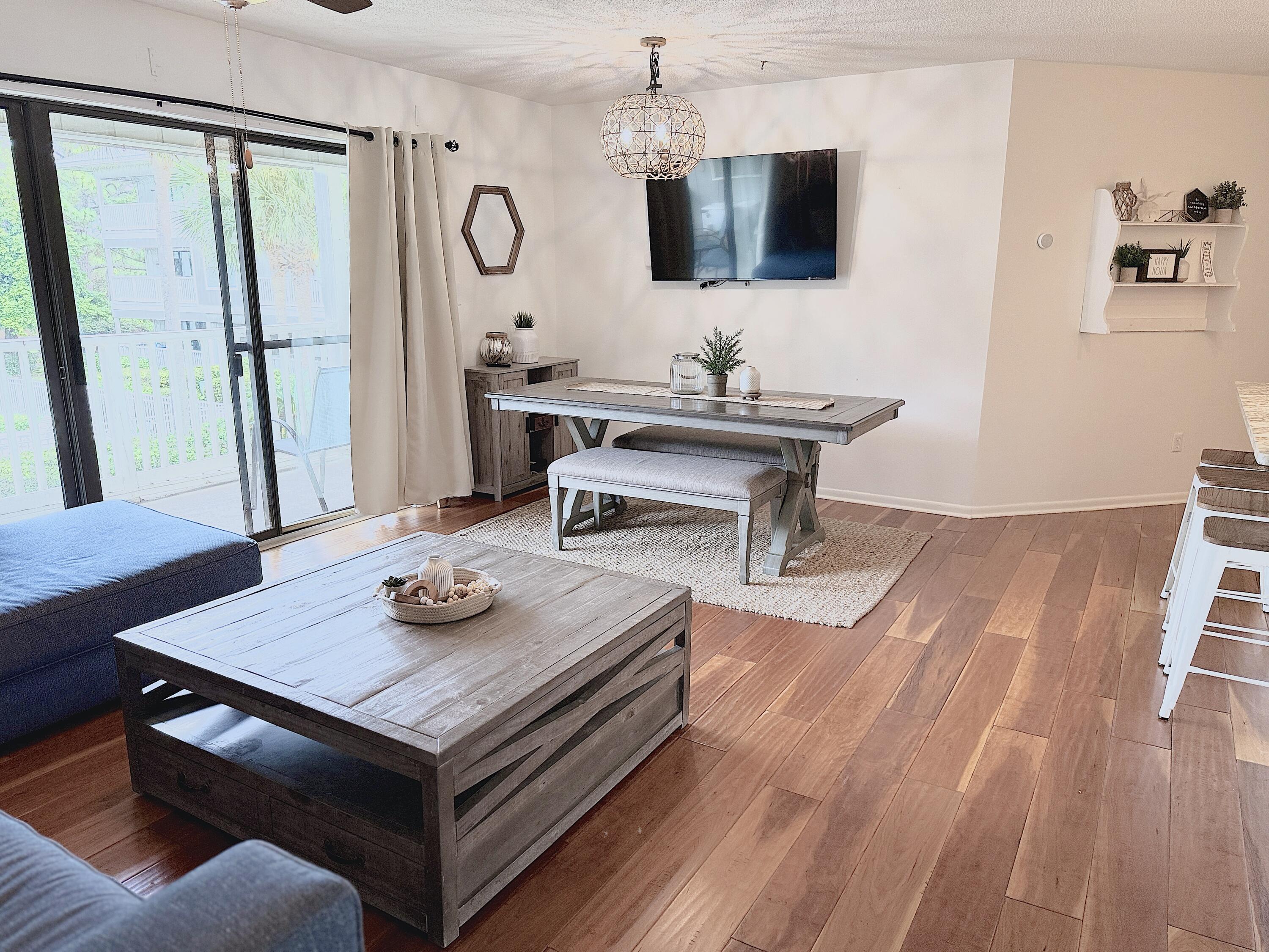 3799 East County Highway 30A, Unit E12 Santa Rosa Beach, FL 32459 - Photo 5 of 34 a living room with furniture and a flat screen tv